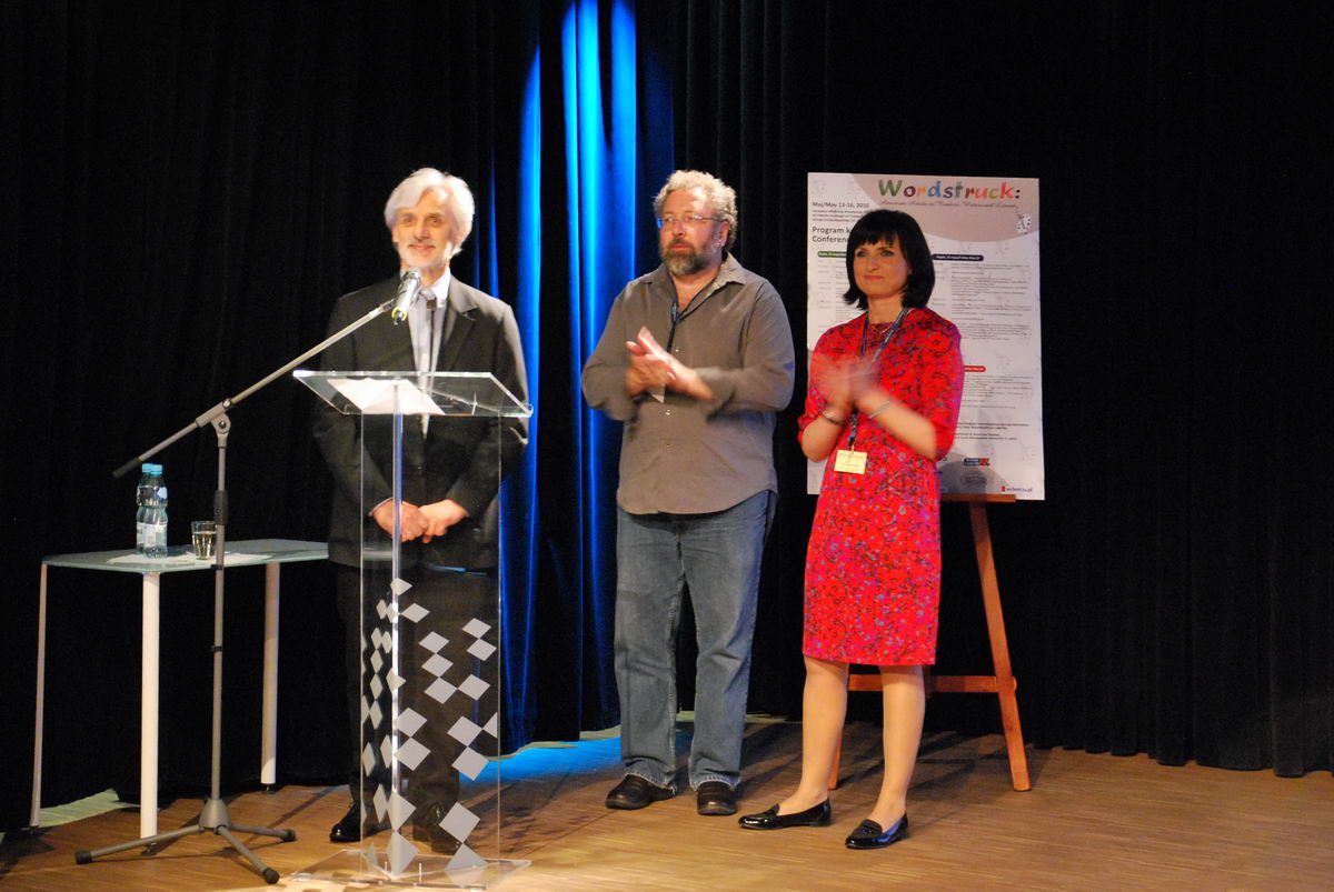 Three people standing at a podium.