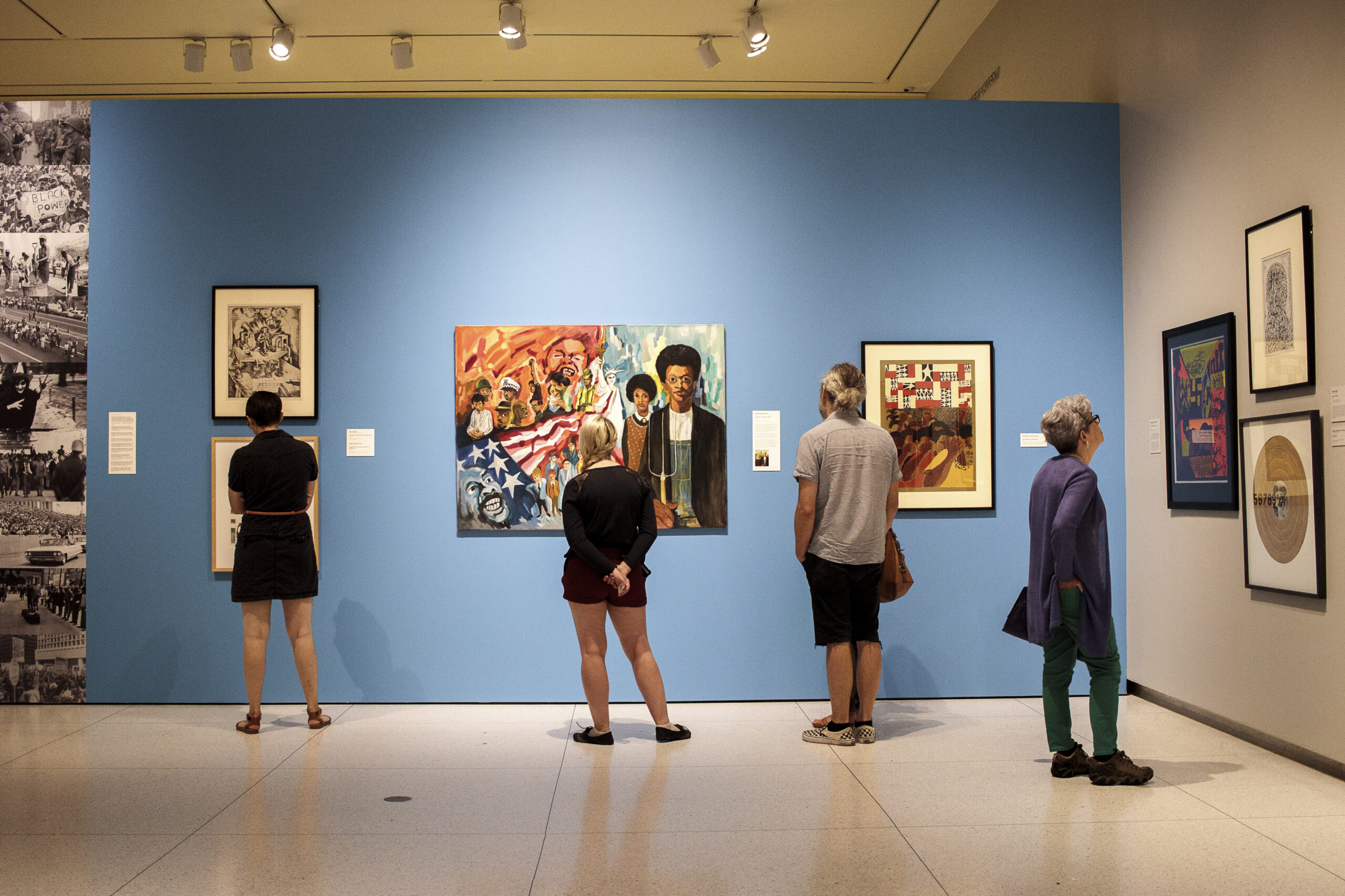 Visitors in an art museum gallery.