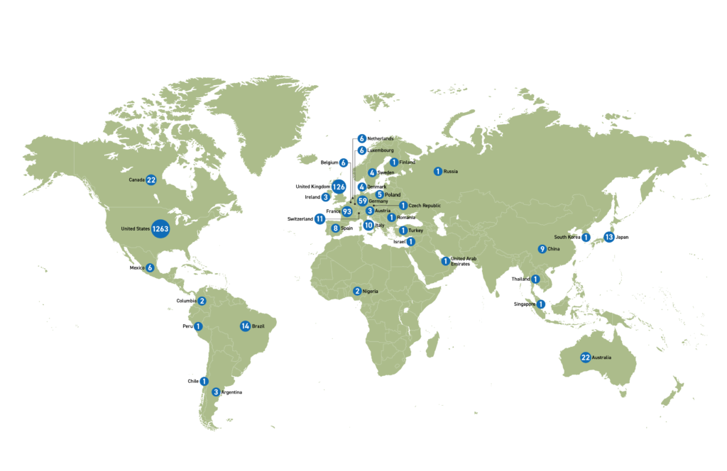 Green map of the world with blue dots marking various countries. Each dot has a number indicating the number of grants given to organizations in that country.