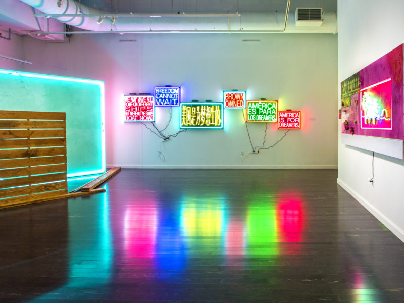 Artwork featuring neon lights installed in a gallery space.