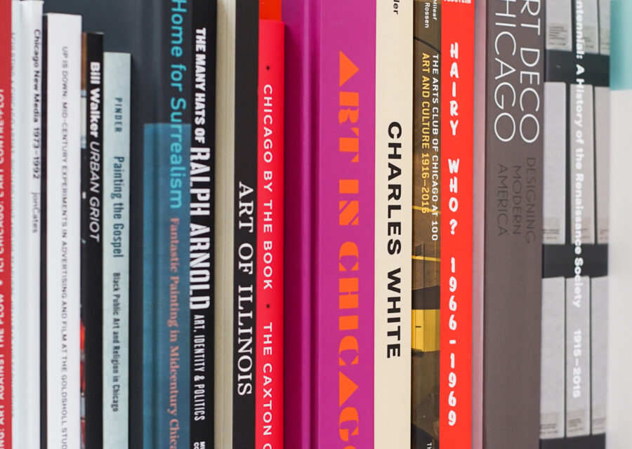 A row of books lined up with their spines facing out.