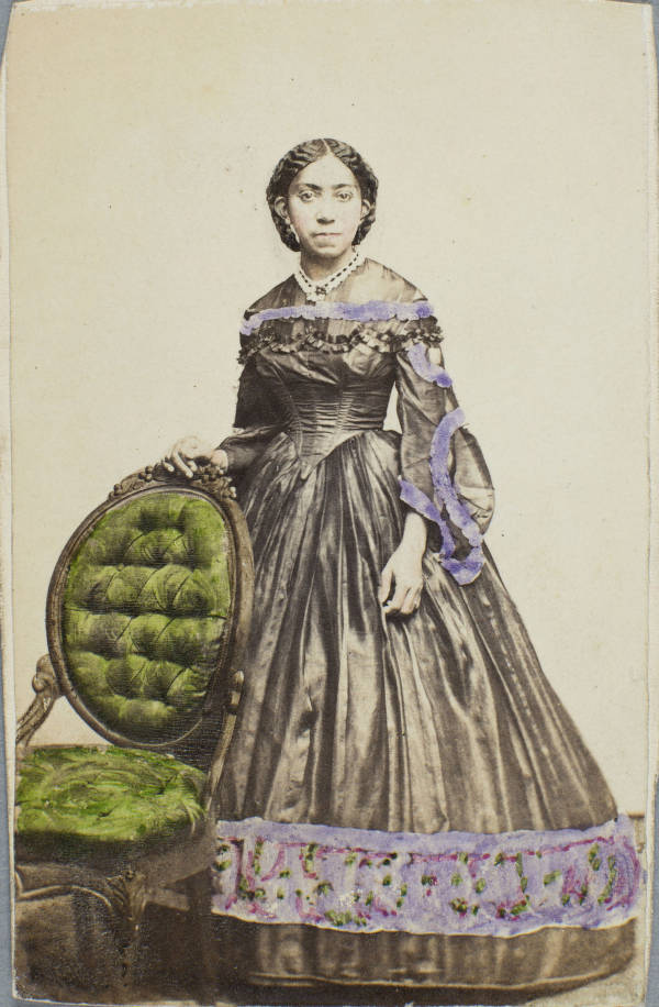 Full-length portrait photograph of Virginia L. Molyneaux Hewlett Douglass wearing a gown.
