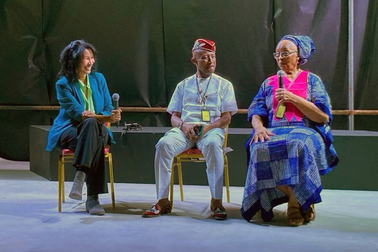 Romi Crawford, Arnold Udoka, and Darlene Blackburn in conversation seated on stage at the Lagos Biennial, 2024.