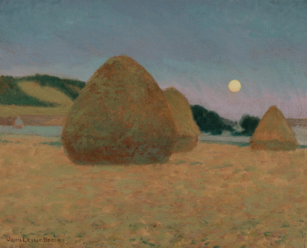 Three haystacks in a field at nighttime. There is a full moon in the sky.