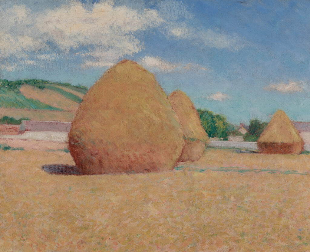 Three haystacks in full sunlight.