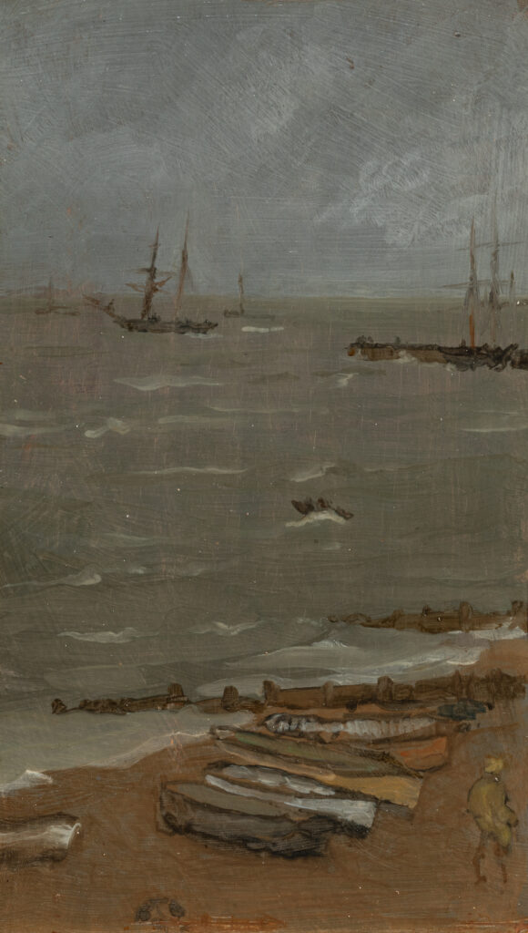 A view of a beach and an ocean. Several small boats rest on the beach.