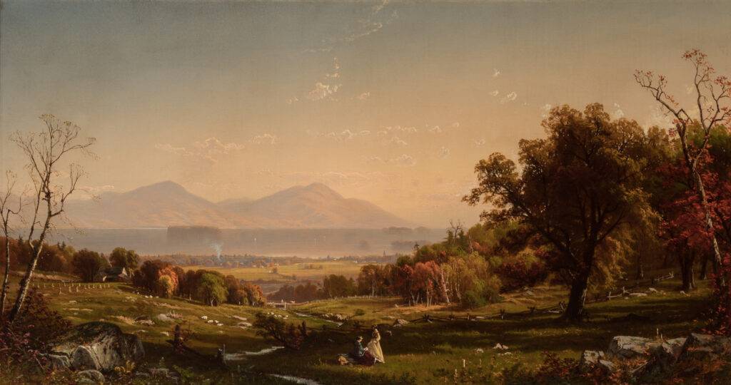 Two women sit in a forest landscape.