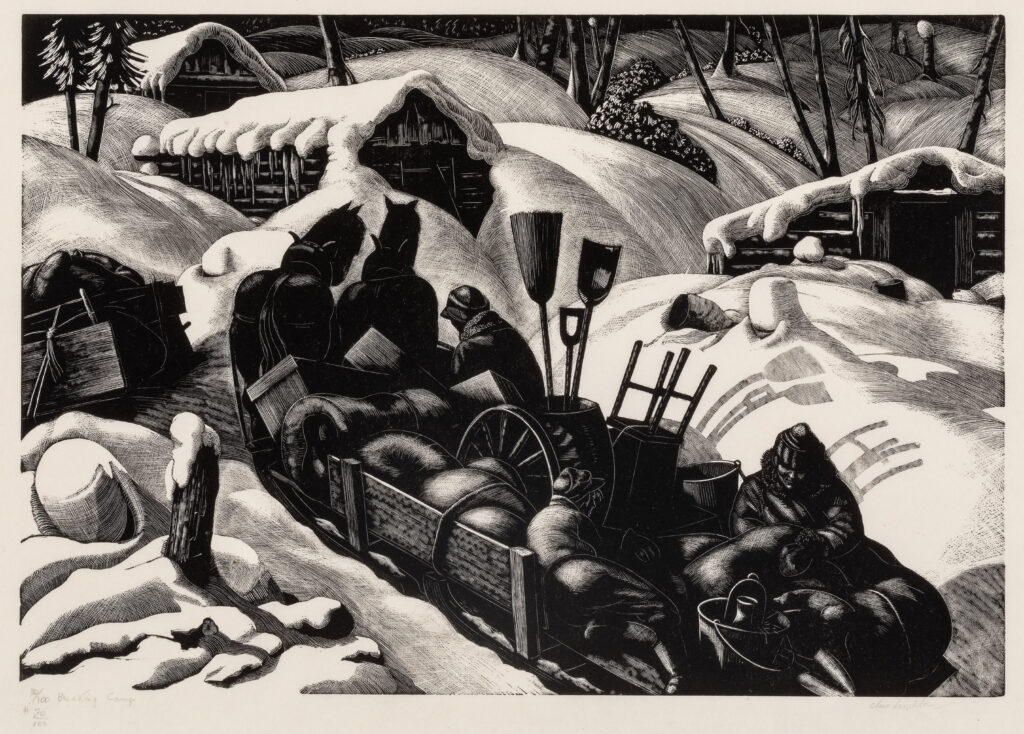 In very deep snow, two people unload a sled full of furniture and materials for living in a cabin in the forest.