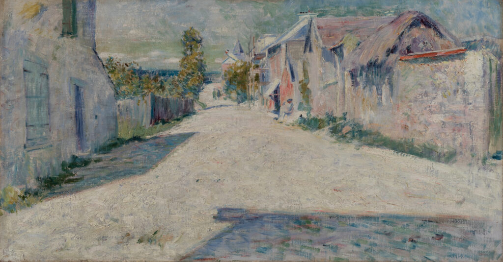 A view of a road through a village.