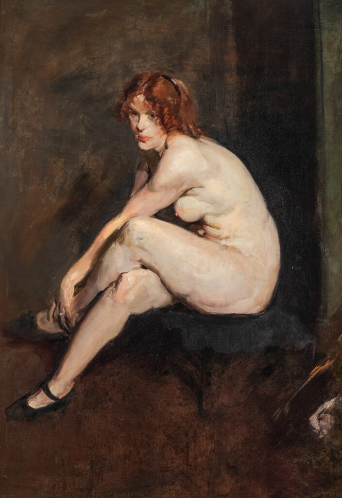 Portrait of a nude woman seated on a stool. Her legs are crossed and she is wearing black shoes.