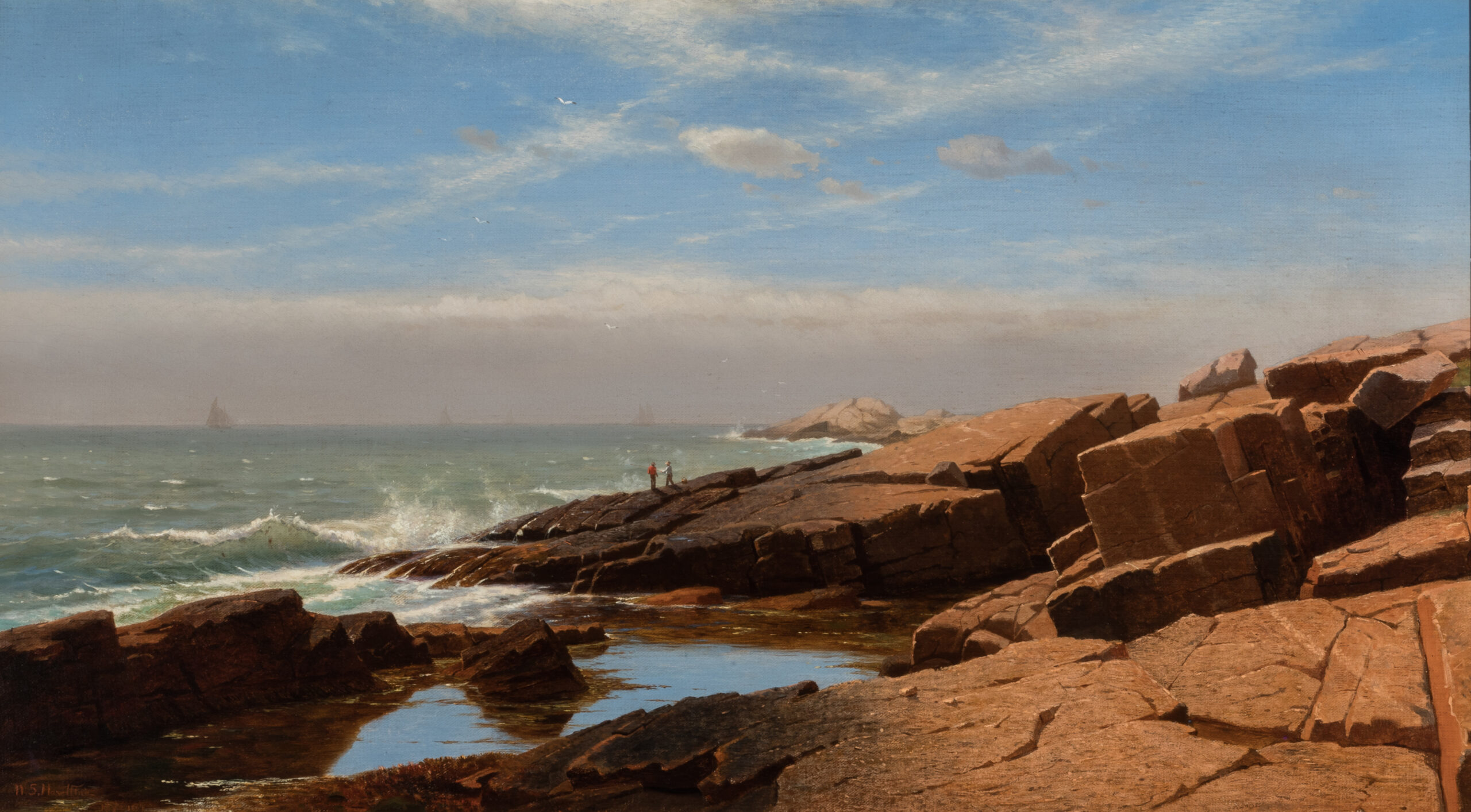 Two figures stand near the edge of the ocean. Behind them is an expanse of jagged rocks.