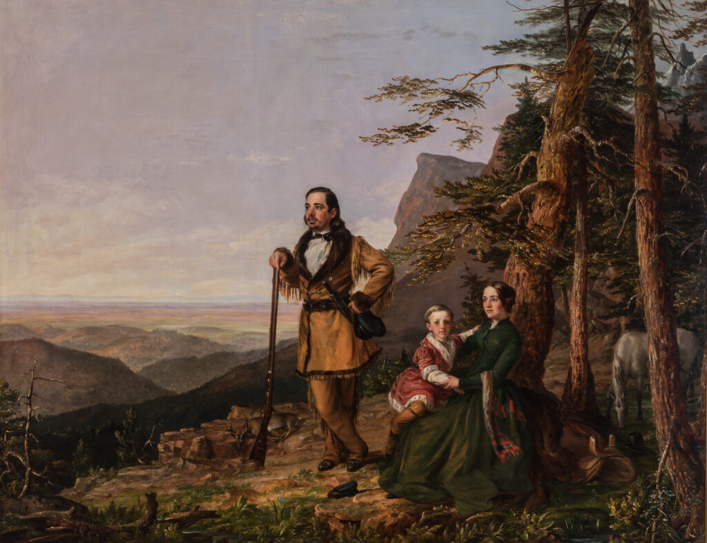 A family rests by a tree on top of a mountain overlooking a vista of land that stretches far into the horizon. A man stands with his arm resting on a gun while a woman sits near the tree holding a child on her lap.