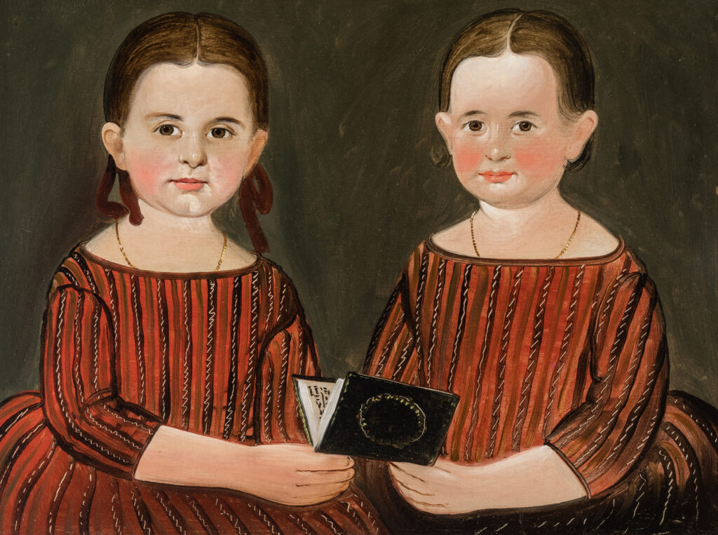 A painting of two girls dressed in identical red dresses holding a small black book between them.