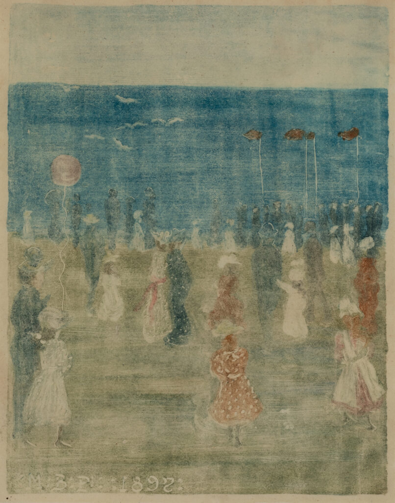 People stroll on the beach.